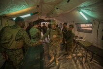 U.S. Marine Corps Lt. Gen. David Berger, 1st Marine Expeditionary Force commanding general, visits corpsmen during Steel Knight 16 at Marine Corps Air-Ground Combat Center, Twentynine Palms, Calif., Dec. 10, 2015. Steel Knight enables 1st Marine Division to test and refine its command and control capabilities by acting as the headquarters element for a forward-deployed Marine Expeditionary Force. (U.S. Marine Corps Combat Camera photograph by ( Lance Cpl. Roderick L. Jacquote)/RELEASED)