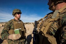 U.S. Marine Corps Col. Kenneth Kassner, left, 5th Marine Regiment commanding officer, briefs Lt. Col. Brian Greene, right, the commanding officer of 2nd Battalion, 4th Marine Regiment, during Steel Knight 16 at Marine Corps Air-Ground Combat Center, Twentynine Palms, Calif., Dec. 10, 2015. Steel Knight enables 1st Marine Division to test and refine its command and control capabilities by acting as the headquarters element for a forward-deployed Marine Expeditionary Force. (U.S. Marine Corps Combat Camera photograph by ( Lance Cpl. Roderick L. Jacquote)/RELEASED)