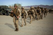 U.S. Marine Corps Sgt. Zane Osborn, a squad leader with Fox Company, 2nd Battalion, 7th Marine Regiment, 1st Marine Division leads his squad during a tactical recovery aircraft personnel exercise as a part of Steel Knight 16 at Marine Corps Air-Ground Combat Center, Twentynine Palms, Calif., Dec. 11, 2015. Steel Knight is an annual field training exercise that enables 1st Marine Division to test and refine its command and control capabilities by acting as the headquarters element for a forward-deployed Marine Expeditionary Force. (U.S. Marine Corps Combat Camera photograph by ( Lance Cpl. Roderick L. Jacquote)/RELEASED)