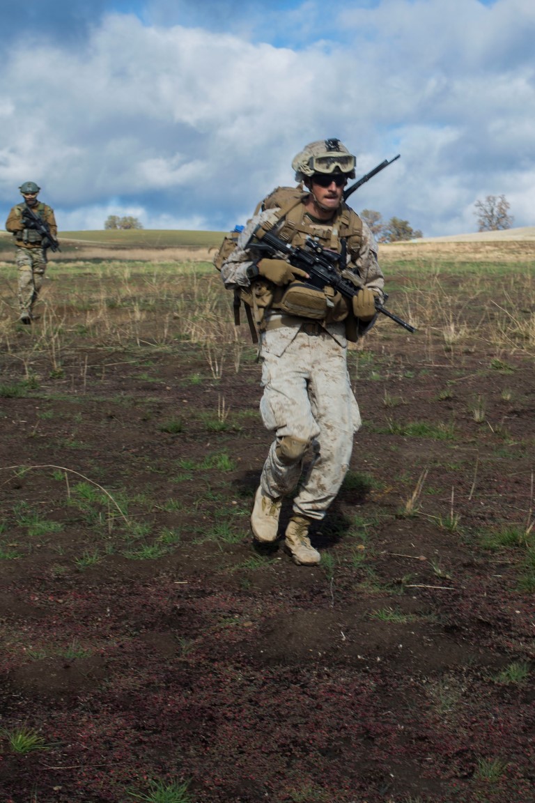 U.S. Marine Corps Cpl. Justin Jones, a squad leader with Fox Company, 2nd Battalion, 7th Marine Regiment, 1st Marine Division sprints during a tactical recovery aircraft personnel exercise as a part of Steel Knight 16 at Fort Hunter Liggett, Calif., Dec. 11, 2015. Steel Knight is an annual field training exercise that enables 1st Marine Division to test and refine its command and control capabilities by acting as the headquarters element for a forward-deployed Marine Expeditionary Force. (U.S. Marine Corps Combat Camera photograph by ( Lance Cpl. Roderick L. Jacquote)/RELEASED)