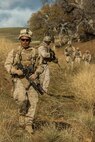 U.S. Marine Corps Lance Cpl. Christopher Tate, a fire team leader with Fox Company, 2nd Battalion, 7th Marine Regiment, 1st Marine Division patrols during a tactical recovery aircraft personnel exercise as a part of Steel Knight 16 at Fort Hunter Liggett, Calif., Dec. 11, 2015. Steel Knight is an annual field training exercise that enables 1st Marine Division to test and refine its command and control capabilities by acting as the headquarters element for a forward-deployed Marine Expeditionary Force. (U.S. Marine Corps Combat Camera photograph by ( Lance Cpl. Roderick L. Jacquote)/RELEASED)