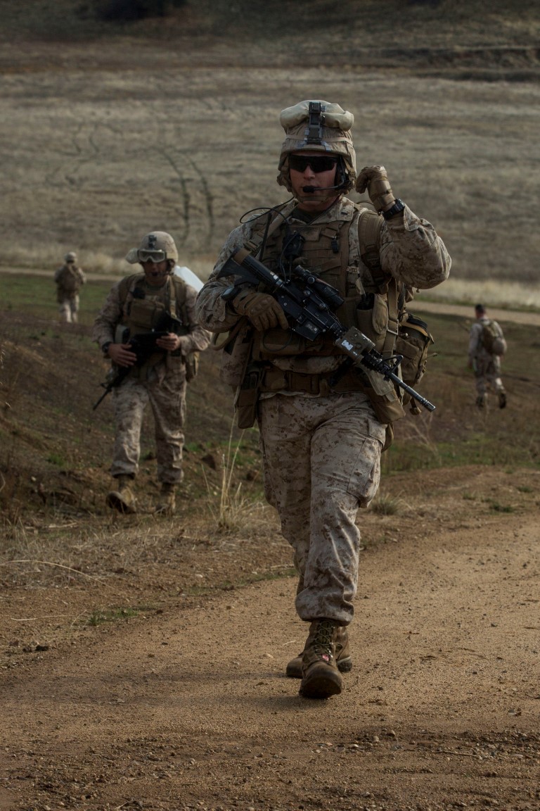 U.S. Marine Corps 1st Lt. Joel Malkin, a platoon commander with Fox Company 2nd Battalion, 7th Marine Regiment, 1st Marine Division rallies a squad during a tactical recovery aircraft personnel exercise as a part of Steel Knight 16 at Fort Hunter Liggett, Calif., Dec. 11, 2015. Steel Knight is an annual field training exercise that enables 1st Marine Division to test and refine its command and control capabilities by acting as the headquarters element for a forward-deployed Marine Expeditionary Force. (U.S. Marine Corps Combat Camera photograph by ( Lance Cpl. Roderick L. Jacquote)/RELEASED)