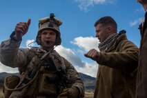 U.S. Marine Corps 1st Lt. Joel Malkin  a platoon commander with Fox Company, 2nd Battalion, 7th Marine Regiment, 1st Marine Division speaks to a role player during a tactical recovery aircraft personnel exercise as a part of Steel Knight 16 at Fort Hunter Liggett, Calif., Dec. 11, 2015. Steel Knight is an annual field training exercise that enables 1st Marine Division to test and refine its command and control capabilities by acting as the headquarters element for a forward-deployed Marine Expeditionary Force. (U.S. Marine Corps Combat Camera photograph by ( Lance Cpl. Roderick L. Jacquote)/RELEASED)