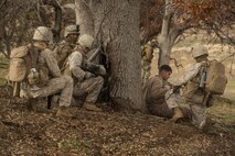 U.S. Marines with Fox Company, 2nd Battalion, 7th Marine Regiment, 1st Marine Division await aircraft extraction during a tactical recovery aircraft personnel exercise as a part of Steel Knight 16 at Fort Hunter Liggett, Calif., Dec. 11, 2015. Steel Knight is an annual field training exercise that enables 1st Marine Division to test and refine its command and control capabilities by acting as the headquarters element for a forward-deployed Marine Expeditionary Force. (U.S. Marine Corps Combat Camera photograph by ( Lance Cpl. Roderick L. Jacquote)/RELEASED)