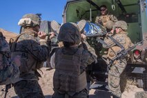 U.S. Marines and Sailors with Headquarters Company, 5th Marine Regiment, 1st Marine Division transport a simulated casualty in an expeditionary field ambulance as a part of a tactical recovery aircraft personnel mission in support of Steel Knight 2016 at Marine Corps Air-Ground Combat Center, Twentynine Palms, Calif., Dec. 12, 2015. Steel Knight is an annual field training exercise that enables 1st Marine Division to test and refine its command and control capabilities by acting as the headquarters element for a forward-deployed Marine Expeditionary Force. (U.S. Marine Corps Combat Camera photograph by ( Lance Cpl. Roderick L. Jacquote)/RELEASED)