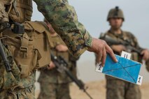 U.S. Marine Corps Maj. Justin Sharpe, 1st Battalion, 1st Marine Regiment operations officer, references an objective on a terrain model during a rehearsal of concept drill as a part of Steel Knight 2016 at Marine Corps Air-Ground Combat Center, Twentynine Palms, Calif., Dec. 9, 2015. Steel Knight is an annual field training exercise that enables 1st Marine Division to test and refine its command and control capabilities by acting as the headquarters element for a forward-deployed Marine Expeditionary Force. (U.S. Marine Corps Combat Camera photograph by ( Lance Cpl. Roderick L. Jacquote)/RELEASED)