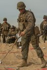 U.S. Marine Corps Capt. Patrick Conrad, a logistics officer with 2nd Battalion, 4th Marine Regiment, 1st Marine Division references an objective during a rehearsal of concept drill as a part of Steel Knight 2016 at Marine Corps Air-Ground Combat Center, Twentynine Palms, Calif., Dec. 9, 2015. Steel Knight is an annual field training exercise that enables 1st Marine Division to test and refine its command and control capabilities by acting as the headquarters element for a forward-deployed Marine Expeditionary Force. (U.S. Marine Corps Combat Camera photograph by ( Lance Cpl. Roderick L. Jacquote)/RELEASED)