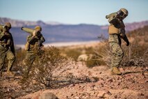 U.S. Marines with Mike Battery, 3rd Battalion, 11th Marine Regiment, 1st Marine Division, carry high explosive rounds during Steel Knight 2016 (SK-16) at Marine Corps Air Ground Combat Center Twentynine Palms, Calif., Dec 11, 2015. SK-16 is an annual military exercise developed to prepare 1st Marine Division personnel within the Ground Combat Element of a Marine Air-Ground Task Force. (U.S. Marine Corps photo by Lance Cpl Ryan Kierkegaard 1st Marine Division Combat Camera /Released)