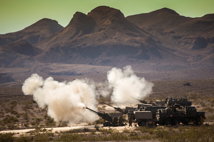 U.S. Marines with Mike Battery, 3rd Battalion, 11th Marine Regiment, 1st Marine Division, conduct a fire mission during Steel Knight 2016 (SK-16) at Marine Corps Air Ground Combat Center Twentynine Palms, Calif., Dec 11, 2015. SK-16 is an annual military exercise developed to prepare 1st Marine Division personnel within the Ground Combat Element of a Marine Air-Ground Task Force. (U.S. Marine Corps photo by Lance Cpl Ryan Kierkegaard 1st Marine Division Combat Camera /Released)