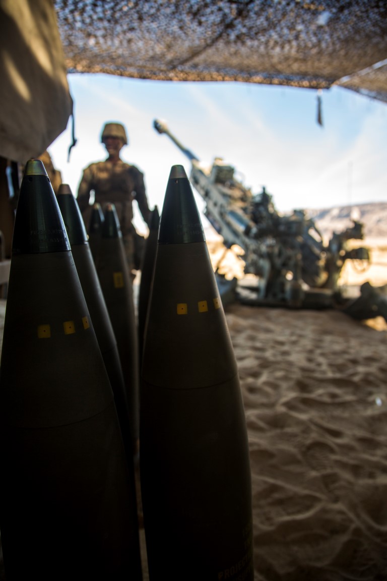 A U.S. Marine with India Battery, 3rd Battalion, 11th Marine Regiment, 1st Marine Division, walks toward high explosive rounds in preparation to firing during Steel Knight 2016 (SK-16) at Marine Corps Air Ground Combat Center Twentynine Palms, Calif., Dec 10, 2015. SK-16 is an annual military exercise developed to prepare 1st Marine Division personnel within the Ground Combat Element of a Marine Air-Ground Task Force. (U.S. Marine Corps photo by Lance Cpl Ryan Kierkegaard 1st Marine Division Combat Camera /Released)