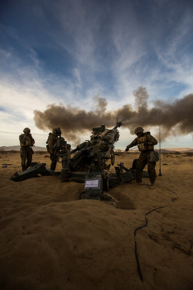 U.S. Marines with India Battery, 3rd Battalion, 11th Marine Regiment, 1st Marine Division, conduct a fire mission during Steel Knight 2016 (SK-16) at Marine Corps Air Ground Combat Center Twentynine Palms, Calif., Dec 10, 2015. SK-16 is an annual military exercise developed to prepare 1st Marine Division personnel within the Ground Combat Element of a Marine Air-Ground Task Force. (U.S. Marine Corps photo by Lance Cpl Ryan Kierkegaard 1st Marine Division Combat Camera /Released)