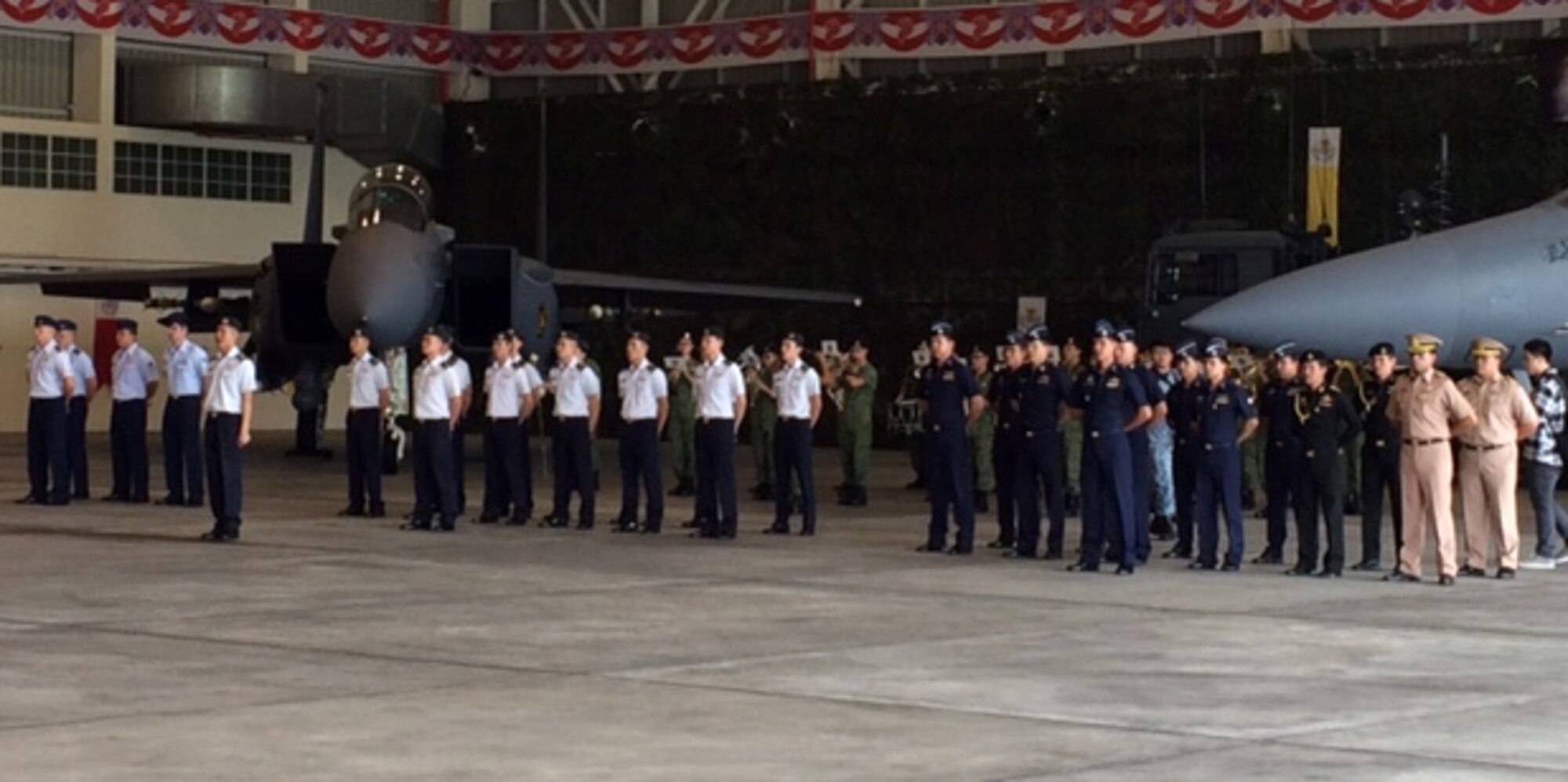 Members from the U.S. Air Force, Royal Thai air force and the Republic of Singapore air force stand in formation during the opening ceremony of exercise Cope Tiger 2016, Korat RTAF Base, Thailand, Dec. 11, 2015. The purpose of the Pacific Air Forces-sponsored field training exercise is to reinforce current relationships by improving combined readiness and interoperability among military partners in the Indo-Asia-Pacific region. (Courtesy photo)