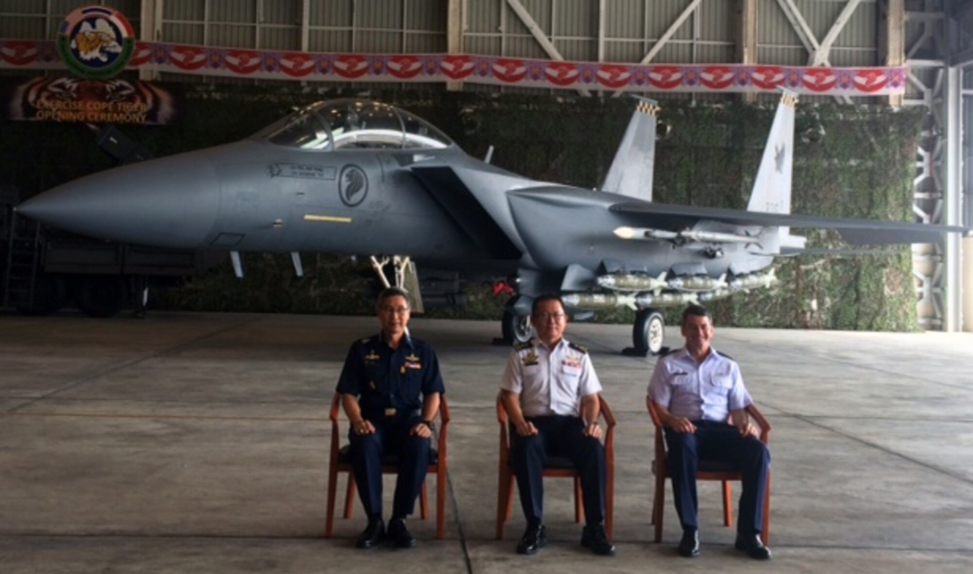 (Left to right) Royal Thai air force Air Chief Marshal Treetod Sonjance, Republic of Singapore air force Maj. Gen. Hoo Cher Moo, RSAF chief of air force, and U.S. Air Force Lt. Gen. Russell Handy, 11th Air Force commander, take a photo in front of a RSAF F-15SG Eagle aircraft during the opening ceremony for exercise Cope Tiger 2016, Korat RTAF Base, Thailand. The purpose of the Pacific Air Forces-sponsored field training exercise is to reinforce current relationships by improving combined readiness and interoperability among military partners in the Indo-Asia-Pacific region. (Courtesy photo)