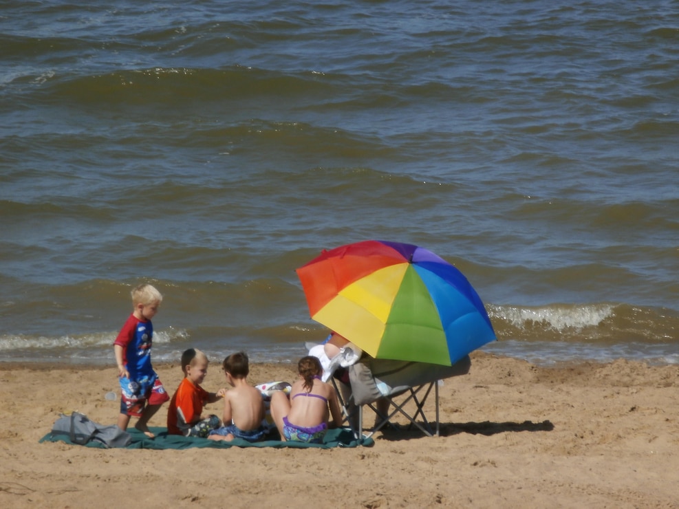 Whitebreast Beach visitors on sand       