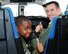 Derrick James, 8-year-old Pilot for a Day participant, and 1st Lt. Adam King, 48th Flying Training Squadron Instructor Pilot, give a thumbs-up inside a T-1A Jayhawk Dec. 22 at Columbus Air Force Base, Mississippi. James and his family were paired with host instructor pilots from the 41st Flying Training Squadron for a day of “red carpet” treatment. Observing Air Force tradition, James had his name printed on a jet, making that aircraft officially his for the day. (U.S. Air Force photo/Melissa Doublin)
