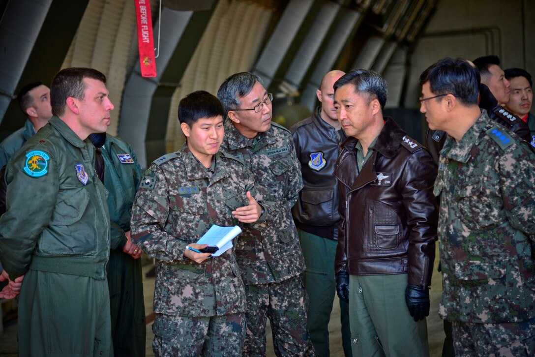 Maj. Craig Morash, 25th Fighter Squadron director of operations, briefs senior leaders from the Republic of Korea Air Force Operations Command on A-10 Thunderbolt II capabilities during an immersion tour at Osan Air Base, ROK, Dec. 17, 2015. Senior Leaders toured the base to learn about the various aircraft, mission and capabilities the 51st Fighter Wing supports on the peninsula. (U.S. Air Force photo/Tech. Sgt. Travis Edwards)

