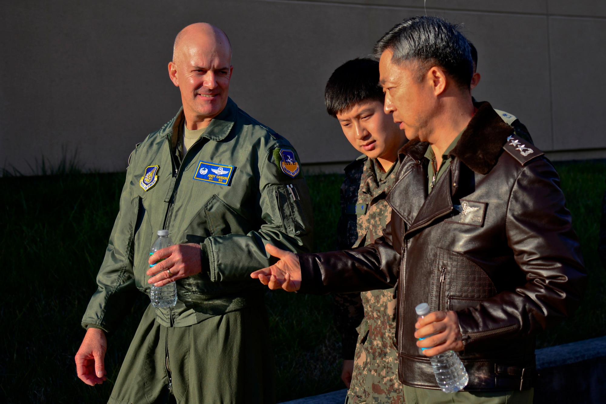 Col. Andrew Hansen, 51st Fighter Wing commander, discusses beddown capabilities with Republic of Korea air force Lt. Gen. Lee, Wang Keun, Air Force Operations Command commander, at Osan Air Base, ROK, Dec. 17, 2015. Senior leaders from the ROK AFOC toured the base to learn about the various aircraft, mission and capabilities the 51st FW supports on the peninsula. (U.S. Air Force photo/Tech. Sgt. Travis Edwards)