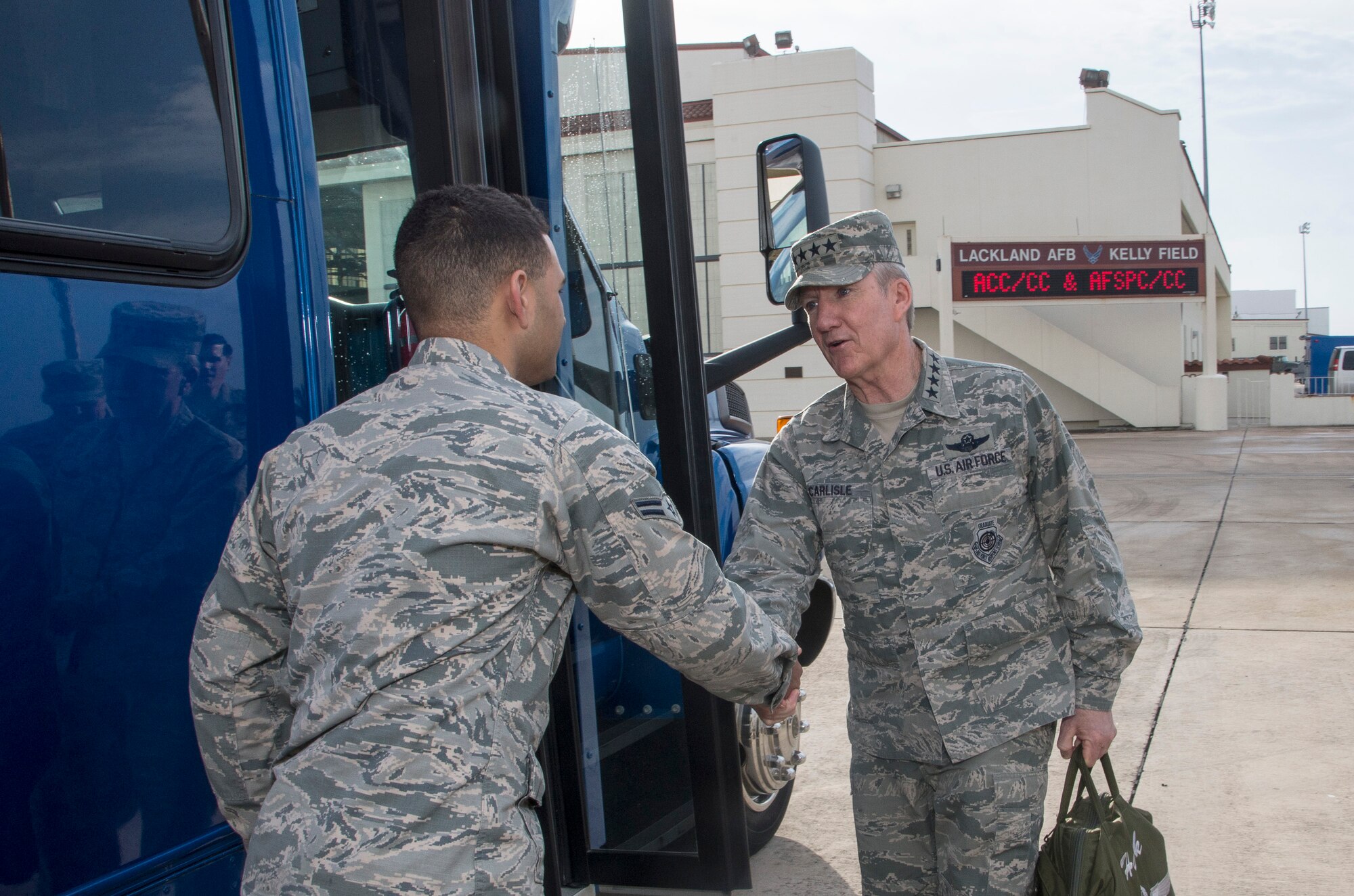 Photo of Gen. Hawk Carlisle, greets Airman 1st Class Tariq Williams, 502nd Transportation Specialist during a visit to Joint Base San Antonio-Lackland