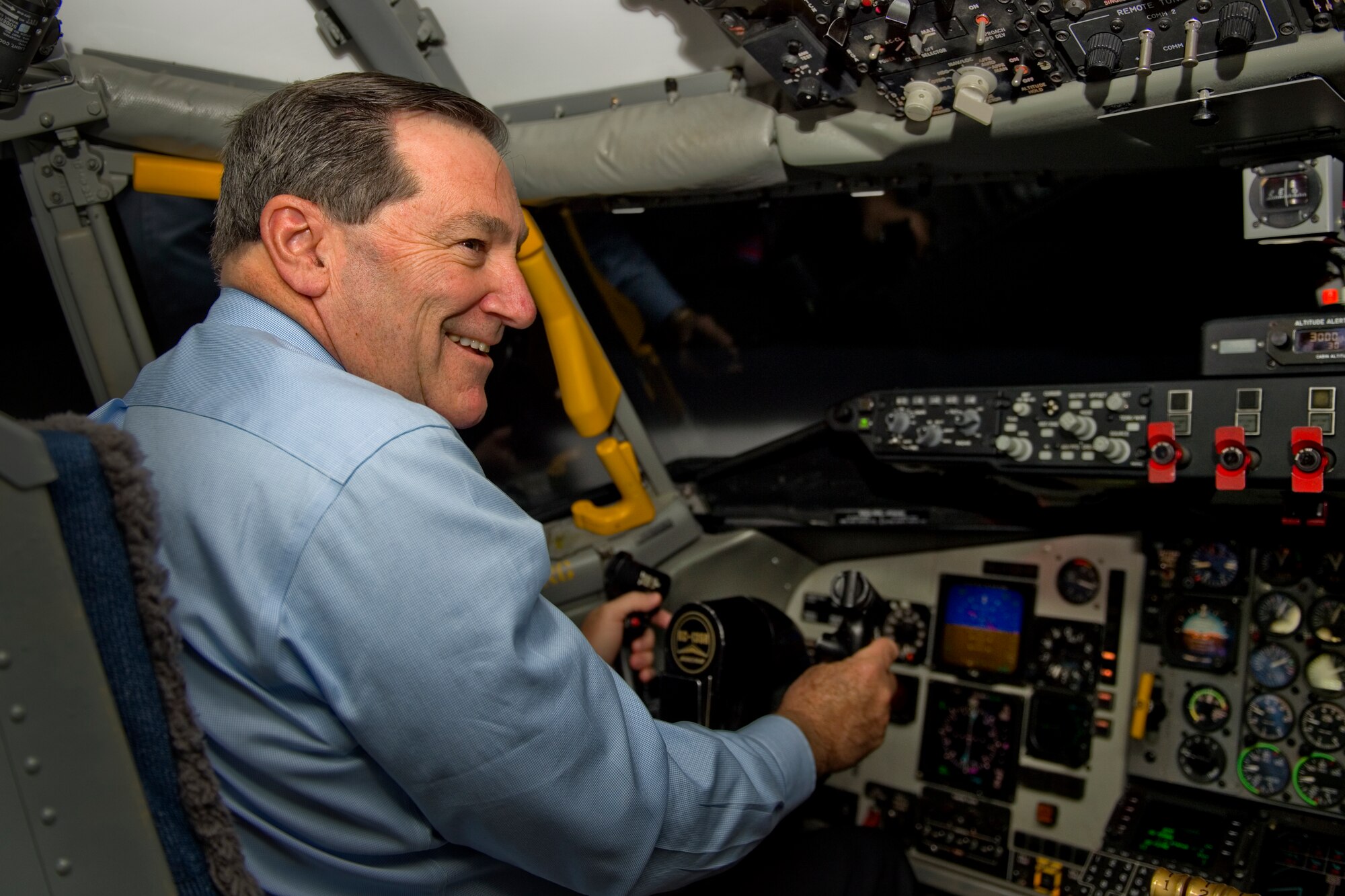 Sen. Joe Donnelly works the controls of a KC-135R Stratotanker simulator during a visit to Grissom Air Reserve Base, Ind., Dec. 16, 2015. During the visit Donnelly met with Secretary of the Air Force Deborah Lee James and Airmen to gain a better understanding of Grissom's mission capabilities.  (U.S. Air Force photo/Tech. Sgt. Benjamin Mota)
