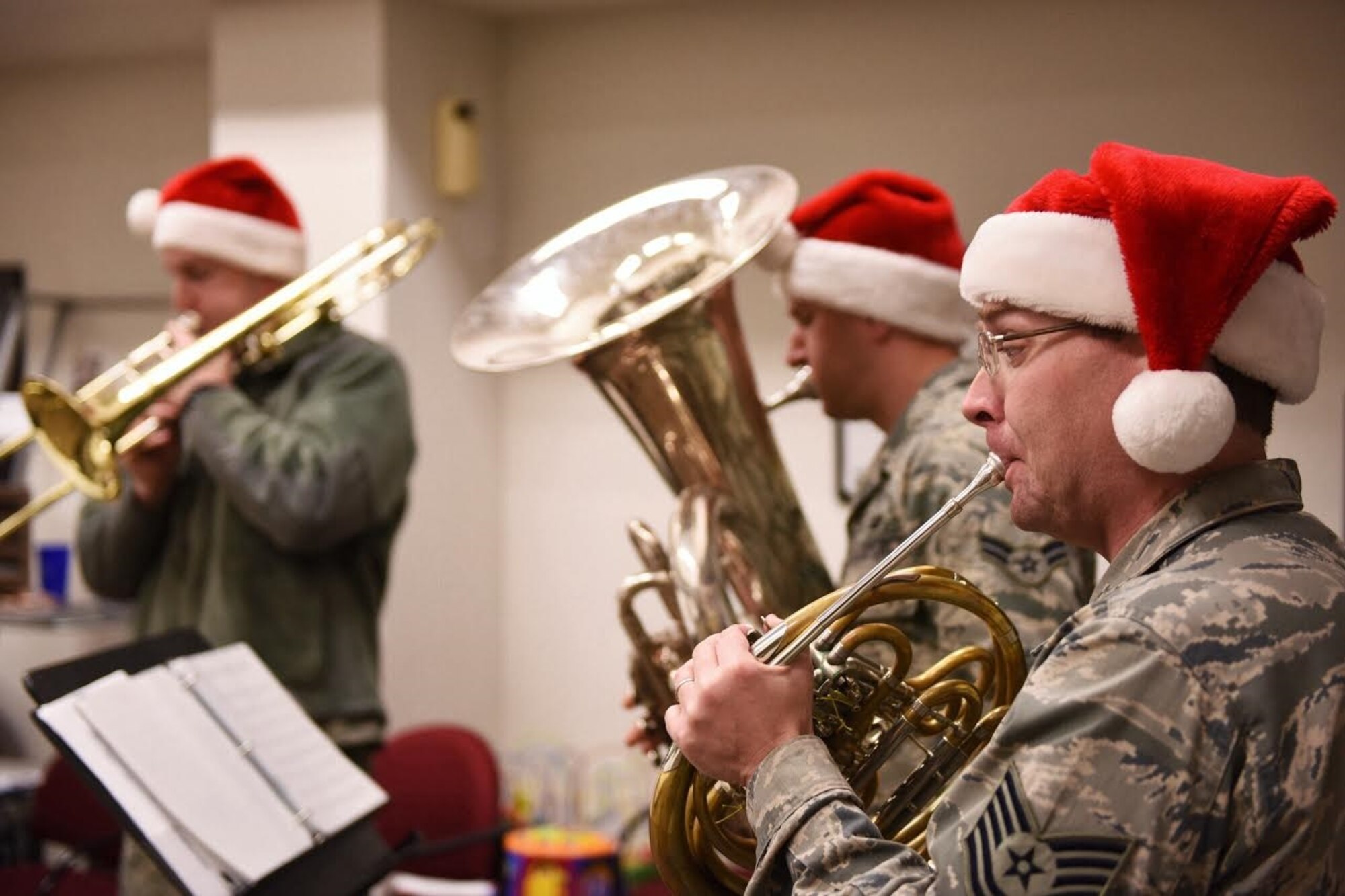 Technical Sgt. Scott Wise, staff arranger and French horn player with the
USAF Band of the Golden West, performs during a holiday visit to the 940th
Wing headquarters Dec. 15, 2015 at Beale Air Force Base, CA.  The brass
quintet based out of Travis Air Force Base, CA performed at various
locations around Beale. (U.S. Air Force photo by Staff Sgt. Brenda
Davis/Released)
