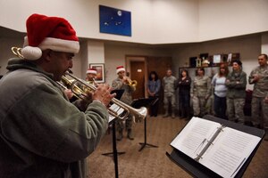 Staff Sgt. Matthew Garza, trumpet player in the Concert Band, the Ceremonial
Band and Travis Brass for the United States Air Force Band of the Golden
West, plays holiday music at the 940th Wing headquarters for members of the
940th Wing to enjoy, Dec. 15, 2015 at Beale Air Force Base, CA.  The brass
quintet based out of Travis Air Force Base, CA performed at various
locations around Beale. (U.S. Air Force photo by Staff Sgt. Brenda
Davis/Released)
