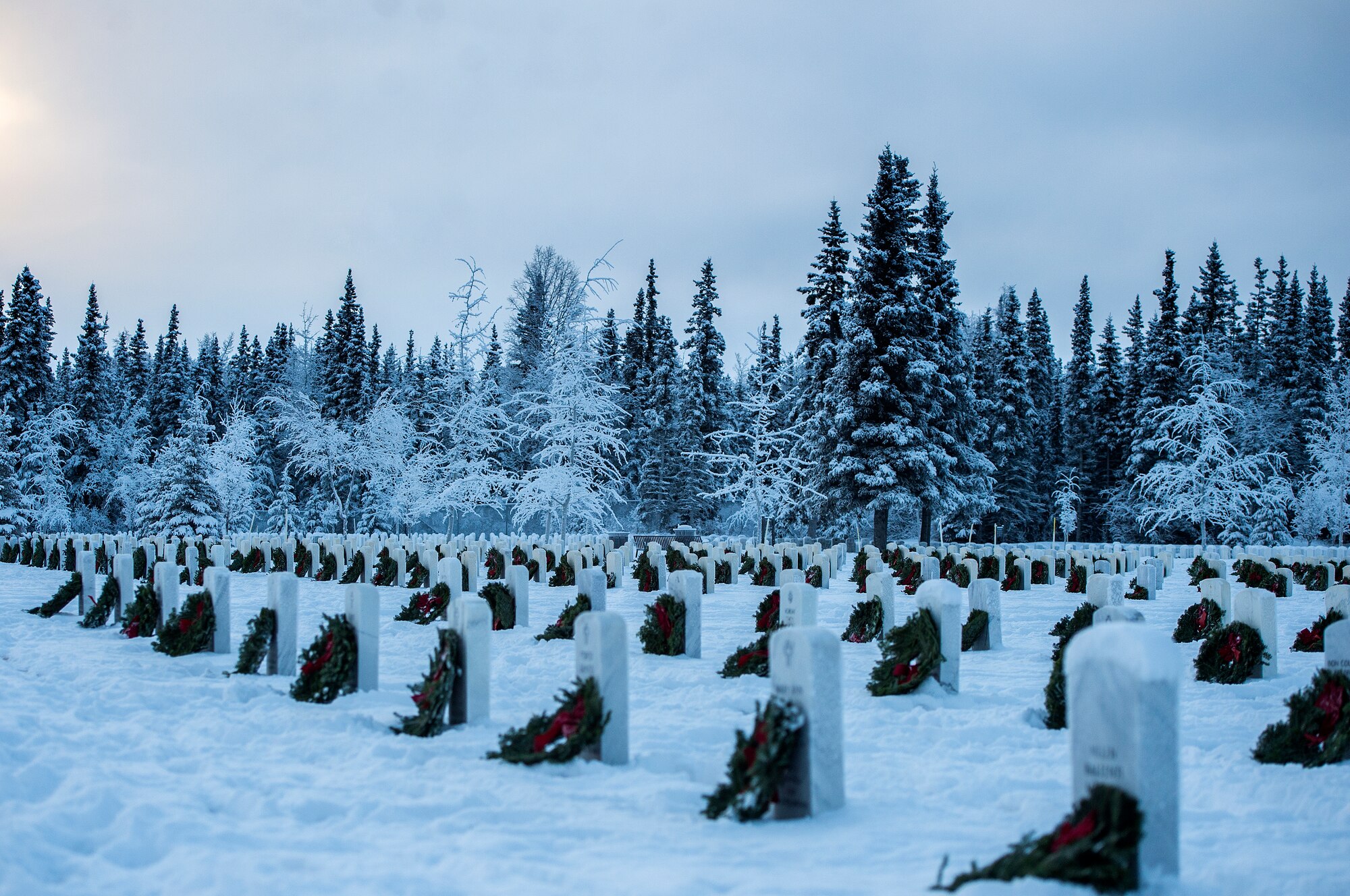 Joint Base Elmendorf-Richardson (JBER) participates in Wreaths Across America Day at the Ft. Richardson National Cemetery, JBER, December 12, 2015.  Wreaths Across America is a nonprofit organization founded to continue and expand the annual wreath laying ceremony at Arlington National Cemetery begun by Maine businessman, Morrill Worcester, in 1992 when his company, Worecester Wreath had a surplus of holiday wreaths.  Wreaths Across America is held annually on the second Saturday of December.  (U.S. Air Force photo by Senior Airman James Richardson)