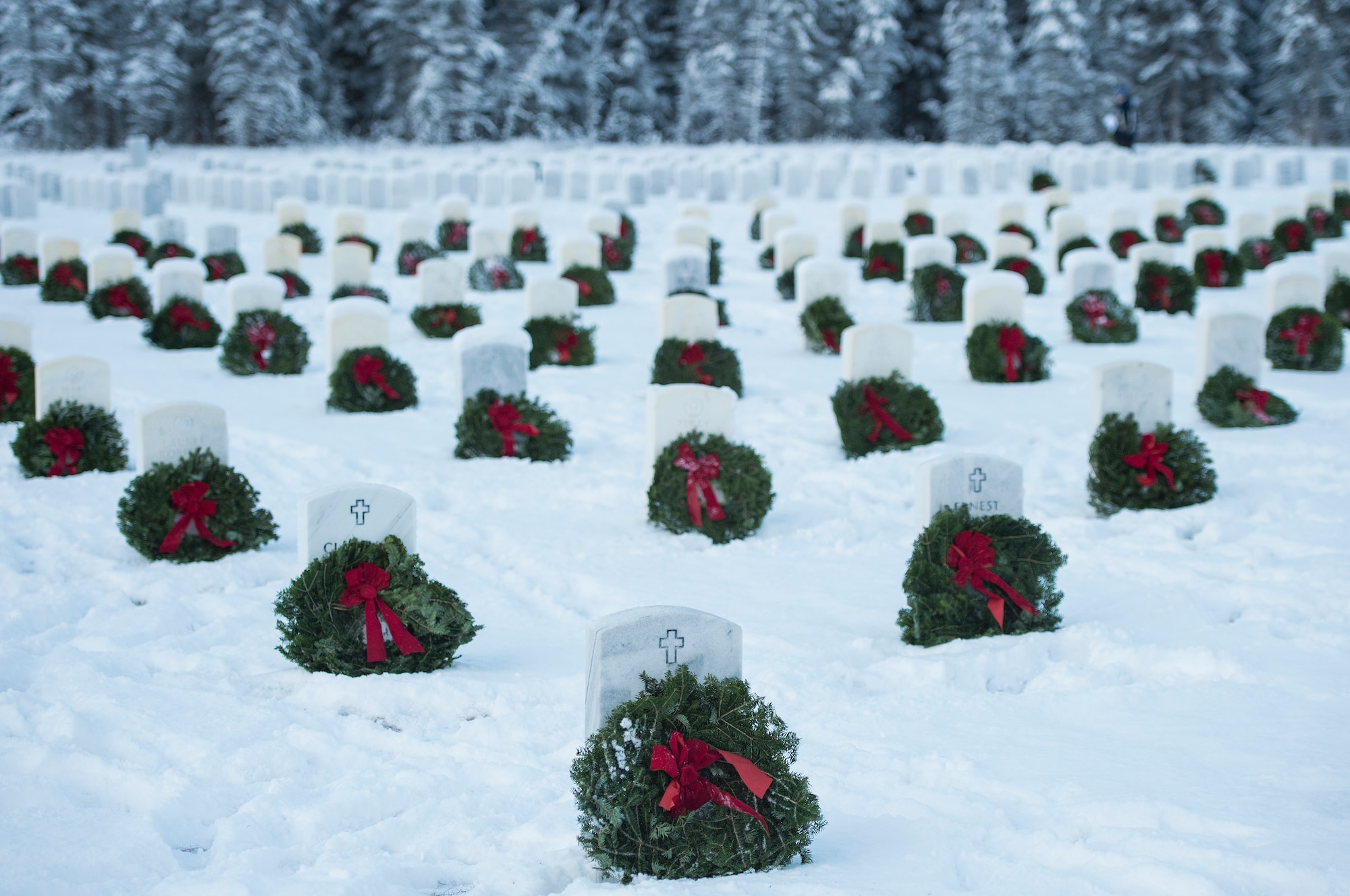 Joint Base Elmendorf-Richardson (JBER) participates in Wreaths Across America Day at the Ft. Richardson National Cemetery, JBER, December 12, 2015.  Wreaths Across America is a nonprofit organization founded to continue and expand the annual wreath laying ceremony at Arlington National Cemetery begun by Maine businessman, Morrill Worcester, in 1992 when his company, Worecester Wreath had a surplus of holiday wreaths.  Wreaths Across America is held annually on the second Saturday of December.  (U.S. Air Force photo by Senior Airman James Richardson)