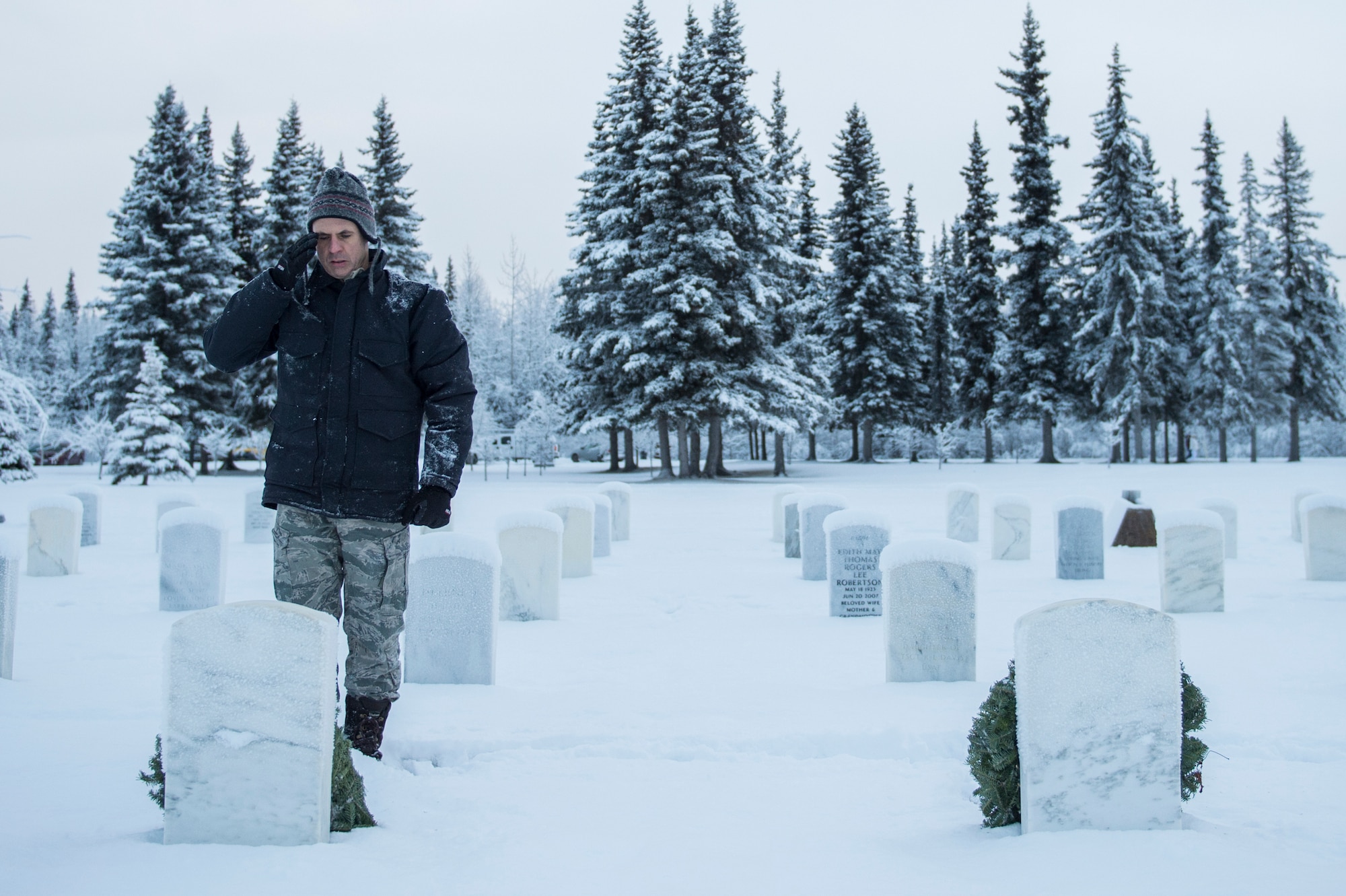 Joint Base Elmendorf-Richardson (JBER) participates in Wreaths Across America Day at the Ft. Richardson National Cemetery, JBER, December 12, 2015.  Wreaths Across America is a nonprofit organization founded to continue and expand the annual wreath laying ceremony at Arlington National Cemetery begun by Maine businessman, Morrill Worcester, in 1992 when his company, Worecester Wreath had a surplus of holiday wreaths.  Wreaths Across America is held annually on the second Saturday of December.  (U.S. Air Force photo by Senior Airman James Richardson)