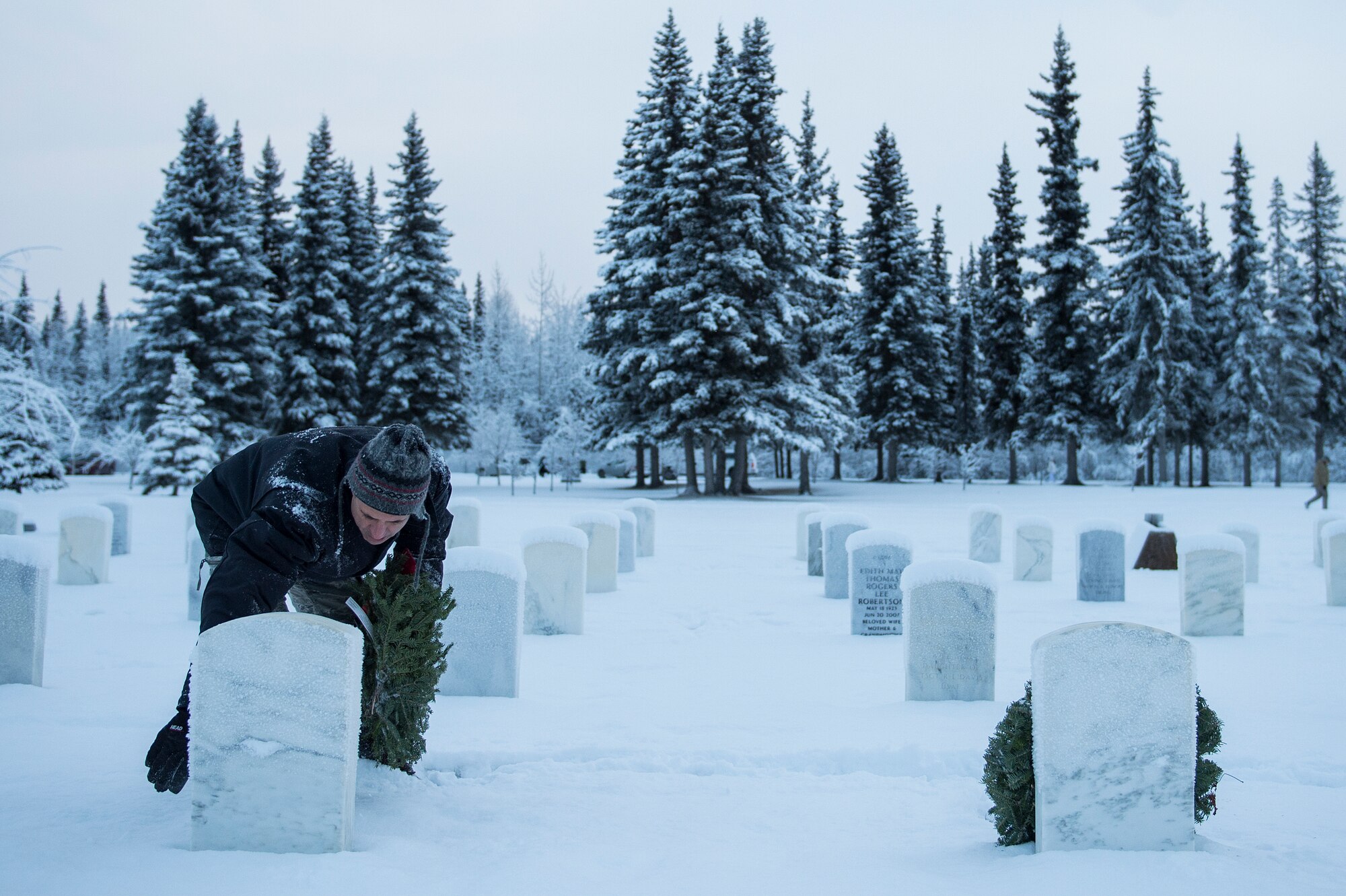 Joint Base Elmendorf-Richardson (JBER) participates in Wreaths Across America Day at the Ft. Richardson National Cemetery, JBER, December 12, 2015.  Wreaths Across America is a nonprofit organization founded to continue and expand the annual wreath laying ceremony at Arlington National Cemetery begun by Maine businessman, Morrill Worcester, in 1992 when his company, Worecester Wreath had a surplus of holiday wreaths.  Wreaths Across America is held annually on the second Saturday of December.  (U.S. Air Force photo by Senior Airman James Richardson)
