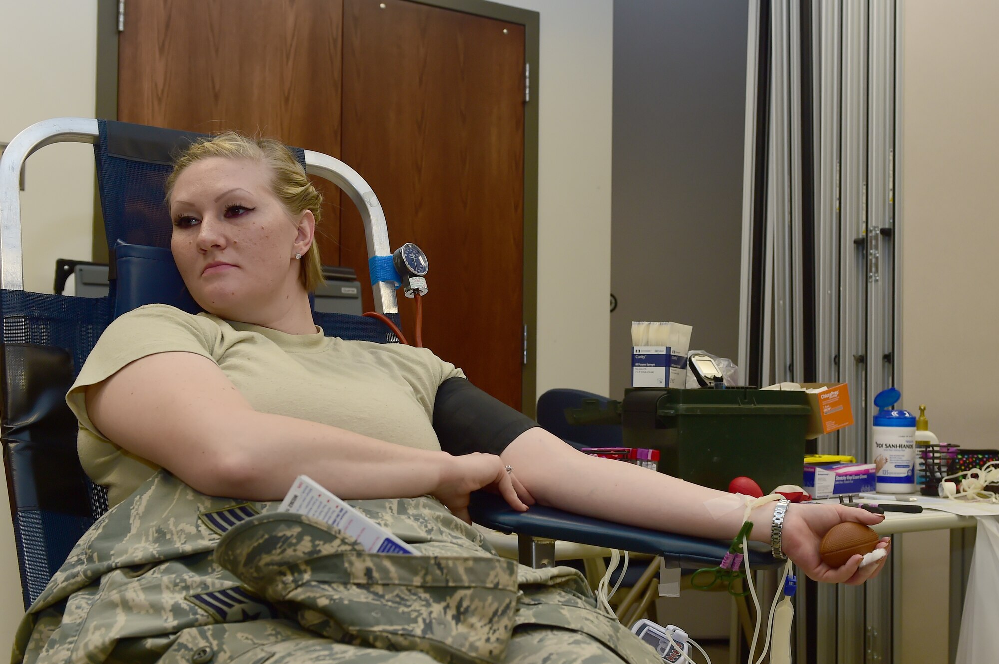 Staff Sgt. Charlotte Teitelbaum, 460th Medical Group bioenvironmental technician, donates blood during a blood drive hosted by Bonfils Blood Center at the Health and Wellness Center Dec. 22, 2015, on Buckley Air Force Base, Colo. The Bonfils Blood Center looks to build awareness and donations for those in need. (U.S. Air Force photo by Airman 1st Class Luke W. Nowakowski/Released)
