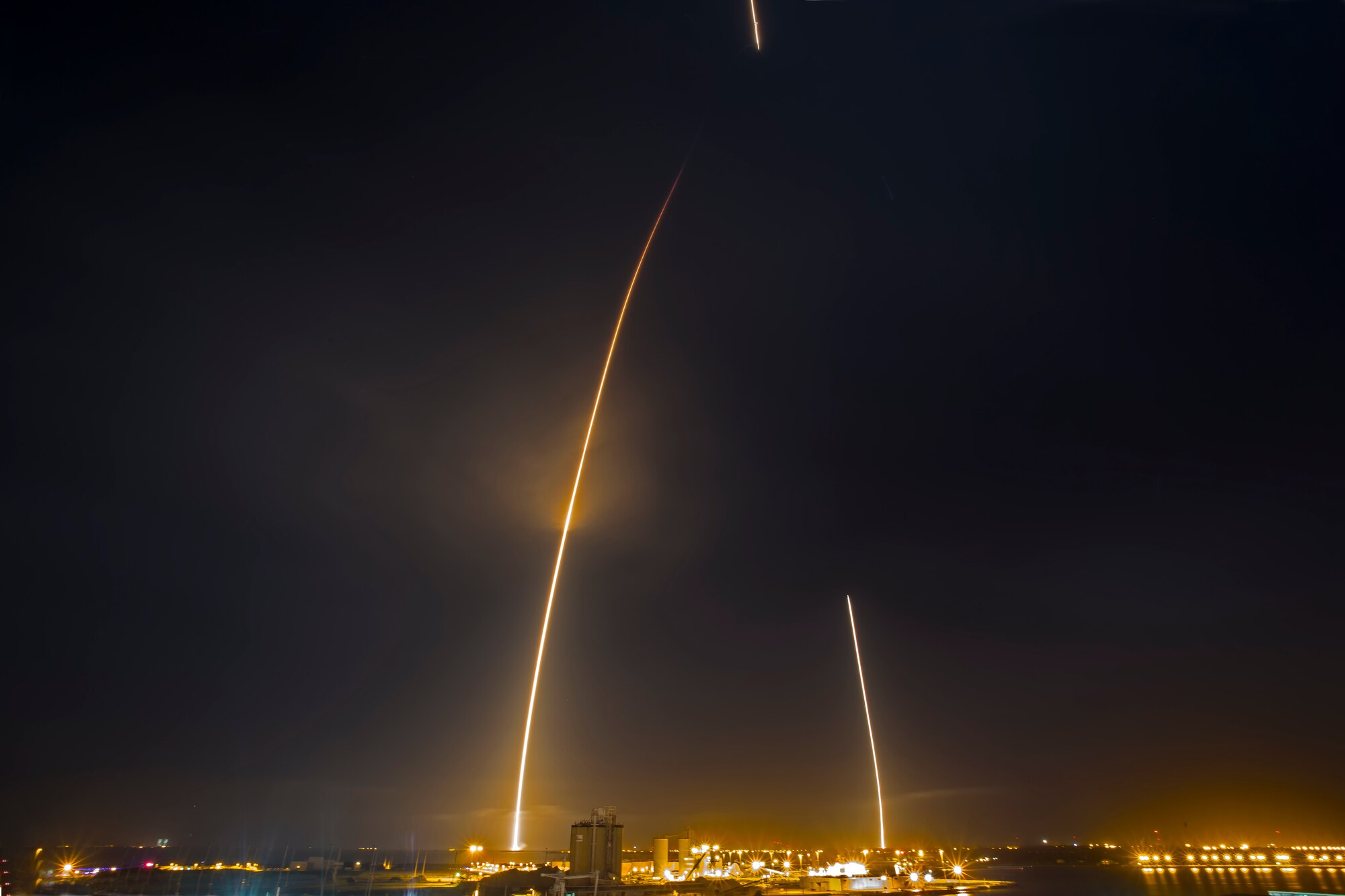 Nine minutes following the successful launch of ORBCOMM’s OG2 communications satellites was the first-ever successful landing of SpaceX’s Falcon 9 first stage booster at Landing Zone 1 (formerly Complex 13) at 8:38 p.m. EST Dec. 21, 2015, on Cape Canaveral Air Force Station. (Courtesy photo/John Studwell/AmericaSpace/limited release)