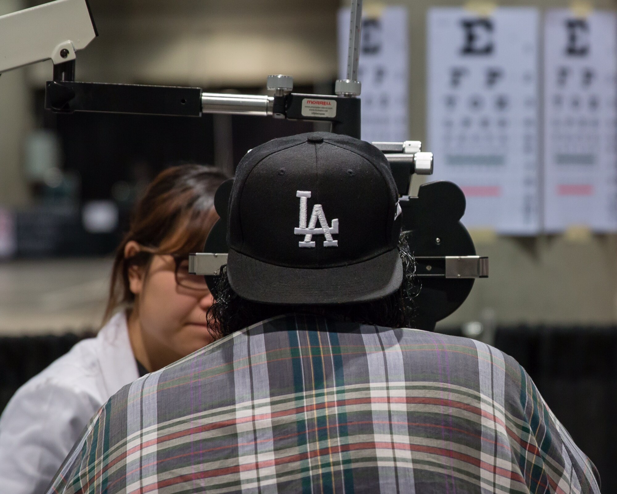 A homeless veteran receives a free eye screening from the VA Greater Los Angeles Health Care System during the 2nd annual L.A. Vets Stand Down. More than 65 volunteers from SMC joined service providers from federal, state, city and county governments as well as local nonprofit partners from across Los Angeles County and the South Bay Dec. 19-21 at the Los Angeles Convention Center. (U.S. Air Force photo/Lt. Col. Chris Troyer)