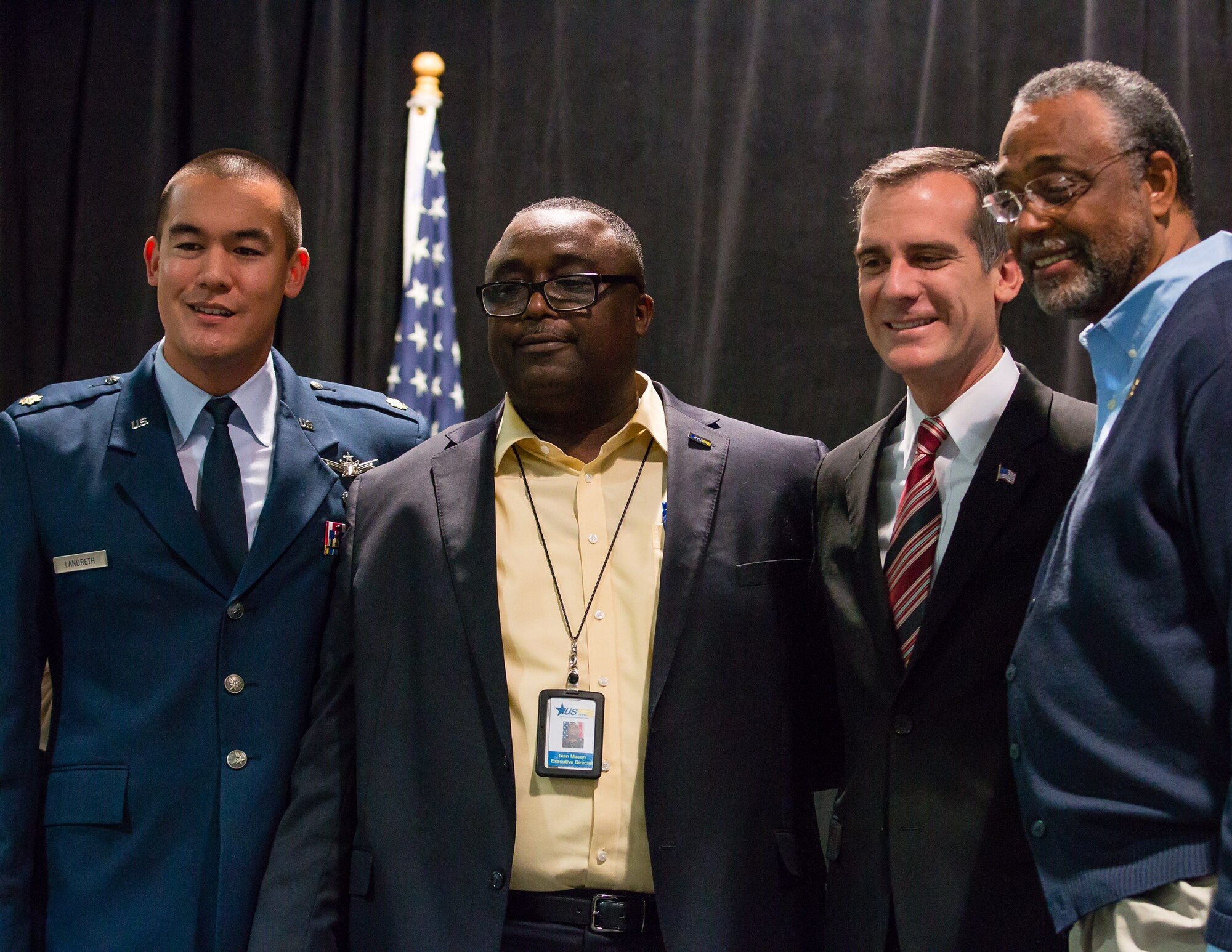 Maj. Dex Landreth, Evolved Expendable Launch Vehicle Mission Integration chief with the Space and Missile Systems Center’s Launch Systems Enterprise Directorate joins Ivan Mason, executive director of U.S. Vets Inglewood, Los Angeles Mayor Eric Garcetti, a U.S. Navy Reserve officer and Los Angeles City Councilman Mr. Curren Price from the 9th District for a group photo during the during the 2nd annual L.A. Vets Stand Down. More than 65 volunteers from SMC joined service providers from federal, state, city and county governments as well as local nonprofit partners from across Los Angeles County and the South Bay Dec. 19-21 at the Los Angeles Convention Center. (U.S. Air Force photo/Lt. Col. Chris Troyer)