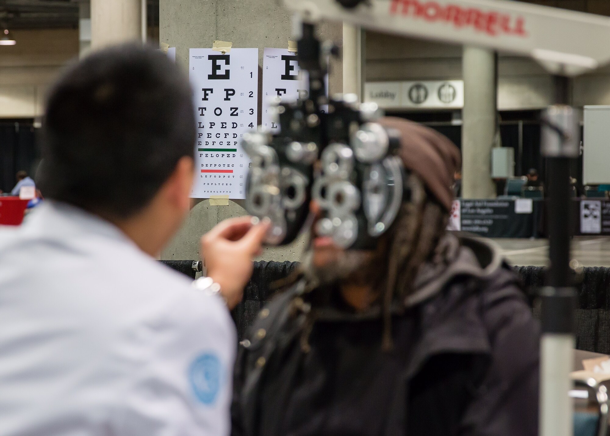 A homeless veteran receives a free eye screening from the VA Greater Los Angeles Health Care System during the 2nd annual L.A. Vets Stand Down. More than 65 volunteers from SMC joined service providers from federal, state, city and county governments as well as local nonprofit partners from across Los Angeles County and the South Bay Dec. 19-21 at the Los Angeles Convention Center. (U.S. Air Force photo/Lt. Col. Chris Troyer)