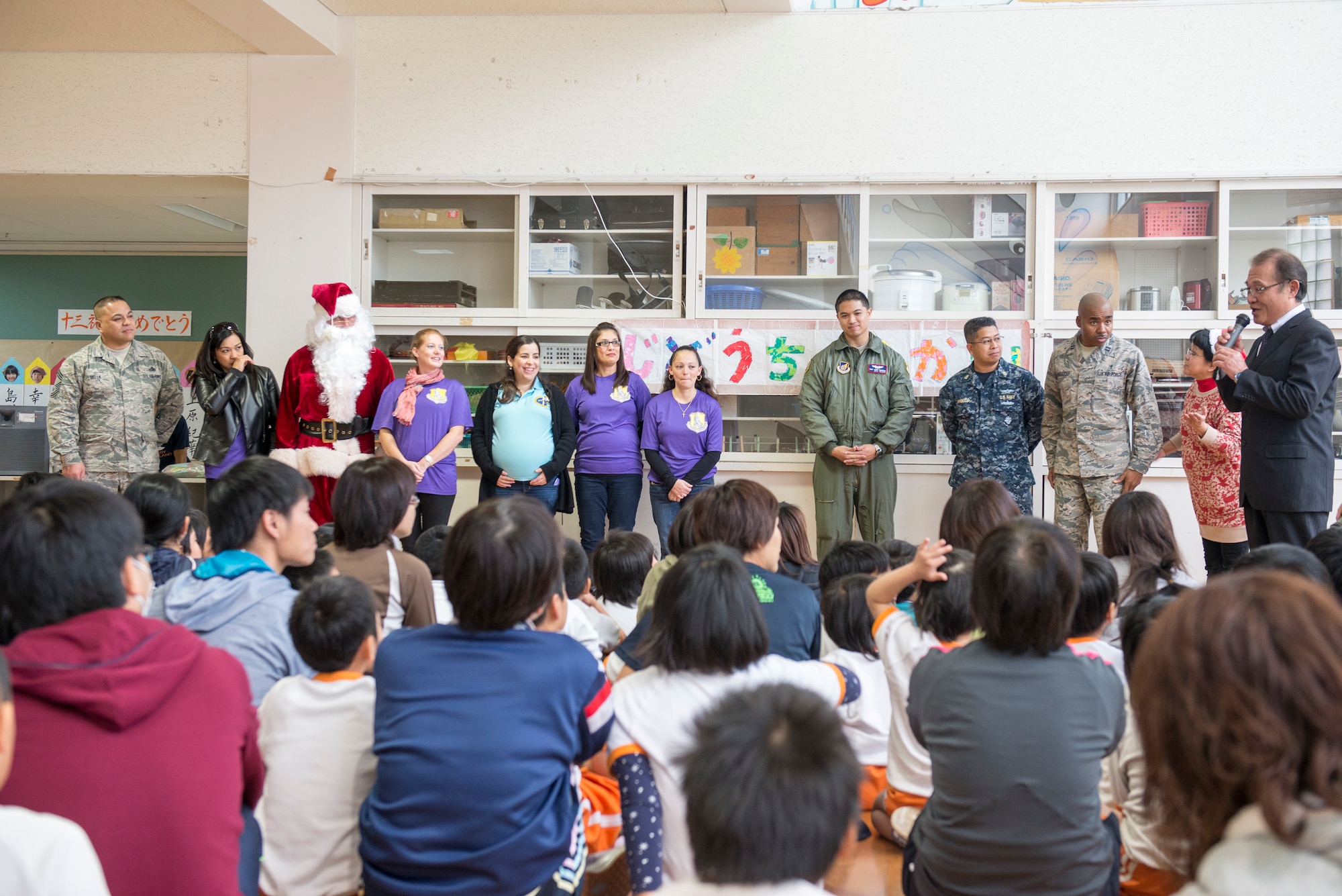 Volunteers from the 18th Wing Chapel receive praise and appreciation from the students and faculty of Misaki Special Needs School, Dec. 17, 2015, at Okinawa City, Japan. Volunteers from the 18th Wing Chapel delivered presents and holiday cheer to the school as part of the Angel Tree program. (U.S. Air Force photo by Senior Airman Omari Bernard)