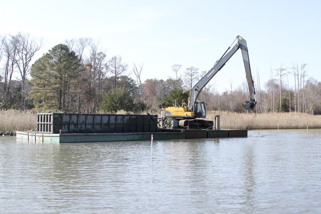 ISLE OF WIGHT COUNTY, Va. -- Dredging contractors work to remove roughly 23,300 cubic yards of material from Tylers Beach, a small harbor of refuge here, December 15, 2015. The $788,800 Sandy Recovery Improvement Act of 2013 funded project allows watermen and other boaters access to and from the small channel and harbor, which at times is impassable. Learn more about the project at https://youtu.be/DROpW9vTTis  (U.S. Army photo/Patrick Bloodgood) 