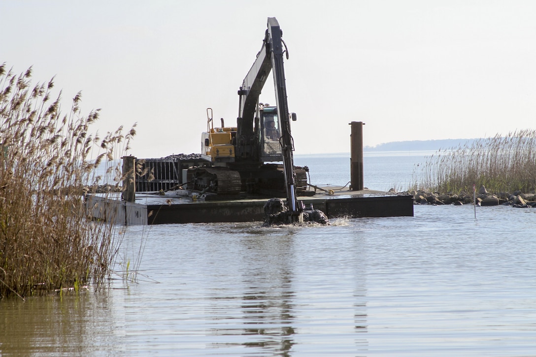 ISLE OF WIGHT COUNTY, Va. -- Dredging contractors work to remove roughly 23,300 cubic yards of material from Tylers Beach, a small harbor of refuge here, December 15, 2015. The $788,800 Sandy Recovery Improvement Act of 2013 funded project allows watermen and other boaters access to and from the small channel and harbor, which at times is impassable. Learn more about the project at https://youtu.be/DROpW9vTTis  (U.S. Army photo/Patrick Bloodgood)  
