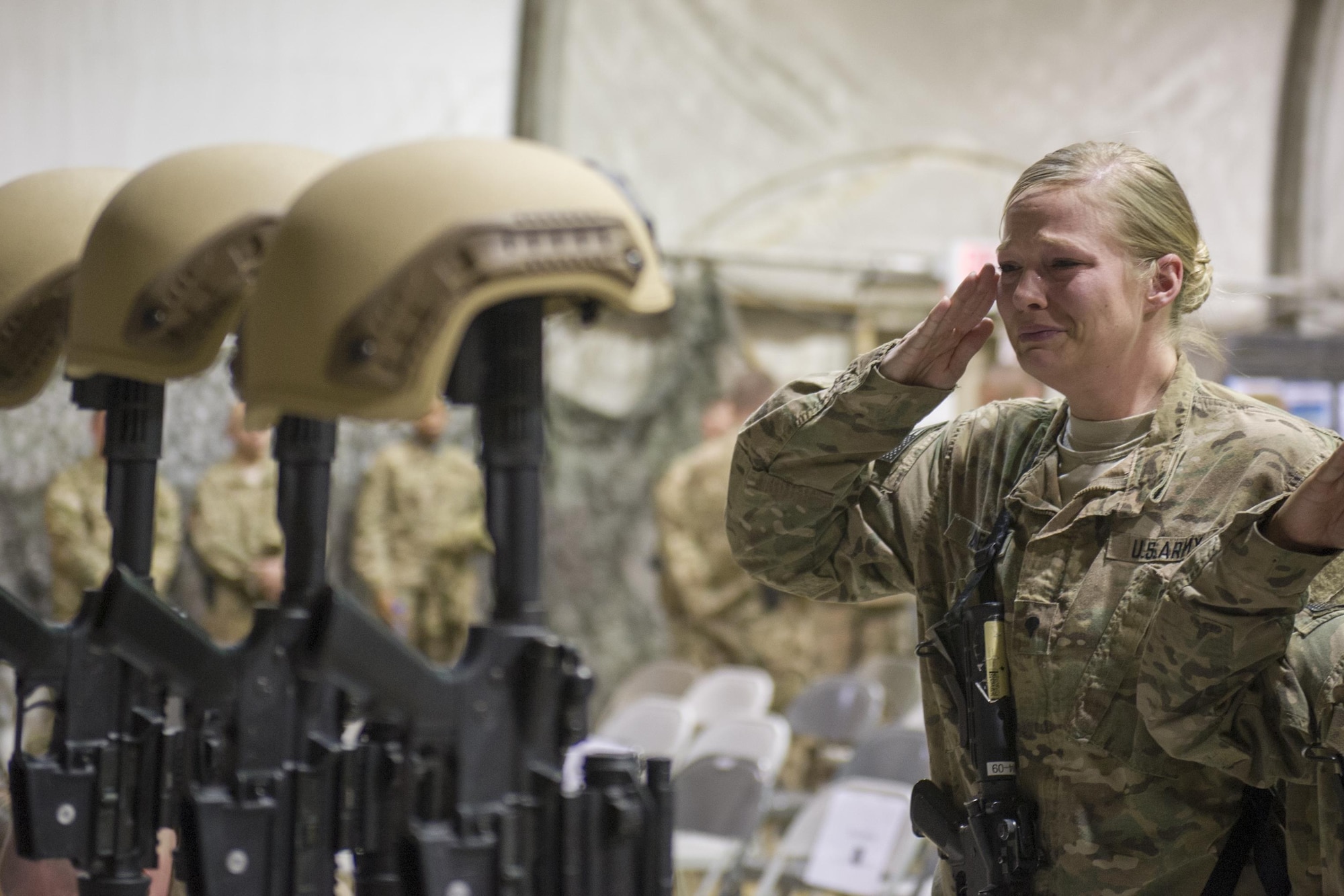 Service members from several units at Bagram Airfield, Afghanistan pay their respects during a fallen comrade ceremony held in honor of six Airmen Dec. 23, 2015.  The six Airmen lost their lives in an improvised explosive attack near Bagram Dec. 21, 2015. (U.S. Air Force photo by Tech. Sgt. Robert Cloys)