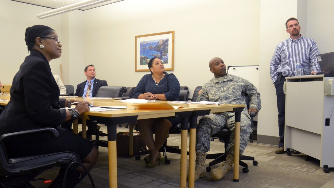 Logisticians from the U.S. Army Corps of Engineers and DLA HQs learn about and discuss DLA Troop Support’s Construction and Equipment products and capabilities during a visit to the organization in Philadelphia Dec. 3, 2015. 