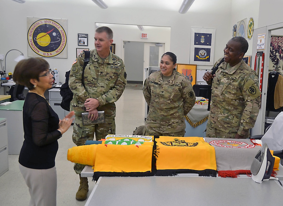 The Defense Logistics Agency’s regional commanders expressed their gratitude for the efforts of the DLA Troop Support workforce during a visit Dec. 2. 

“Working in [U.S. Central Command], where there’s been active war for the last nearly 15 years, we live and die by these supply chains,” said Army Col. Derrin Williams, DLA Central commander.

Williams was joined by Army Col. Elizabeth Keough, DLA Europe and Africa commander, and Army Col. Richard Ellis, DLA Pacific commander. They are DLA’s senior representatives in their respective regions.

While spending the week at DLA Headquarters in Fort Belvoir, Virginia, the three commanders traveled to Philadelphia to meet with representatives of DLA Troop Support’s five supply chains and tour the flag room.

“We mainly wanted to come say thanks,” Keough said. “We couldn’t function without the work that Troop Support does.”

Williams’s gratitude for the Clothing and Textiles supply chain was personal. He was shot by a sniper while deployed to Iraq. But thanks to body armor provided through C&T, the impact was minimized, he said.

“I appreciate the time that goes into testing the [Enhanced Small Arms Protective Insert] plates,” Williams told Keith Ford, C&T deputy director. “I appreciate you making sure it’s right.”

Keough specifically thanked Mary Martin, with the Medical supply chain’s Plans and Integration division, by presenting her a commander’s coin for her work in support of Operation United Assistance. OUA was the Defense Department mission in West Africa to help stop the spread of the deadly Ebola virus

Martin oversaw the transportation of personal protective equipment for personnel from DOD, U.S. Agency for International Development and the Public Health Service. Medical provided more than 1.4 million protective suits, in addition to surgical gloves and surgical masks in support of OUA, Martin said.
