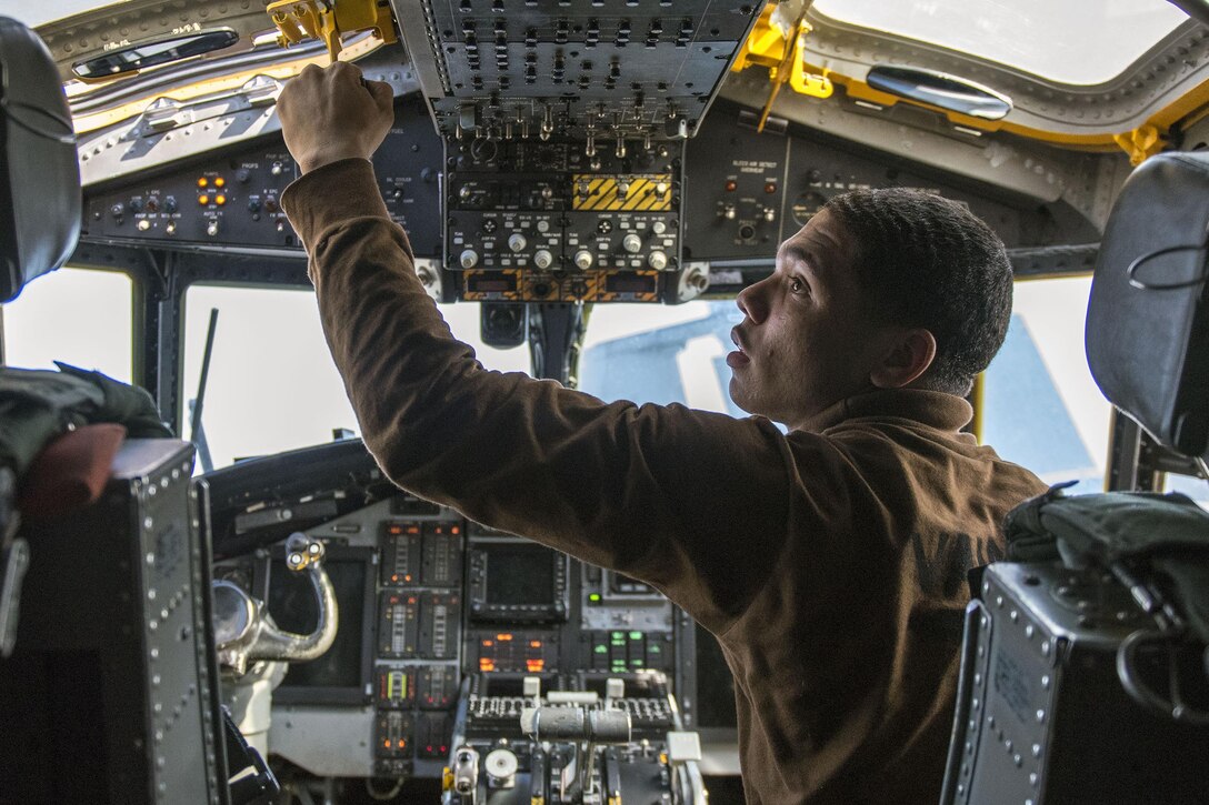 Navy Seaman D. Myers performs the daily turnaround inspection on an E-2C Hawkeye on the flight deck of the USS Harry S. Truman in the Gulf of Aden, Dec. 22, 2015. Myers is an aviation machinist's mate. Navy photo by Petty Officer 3rd Class J.R. Pacheco