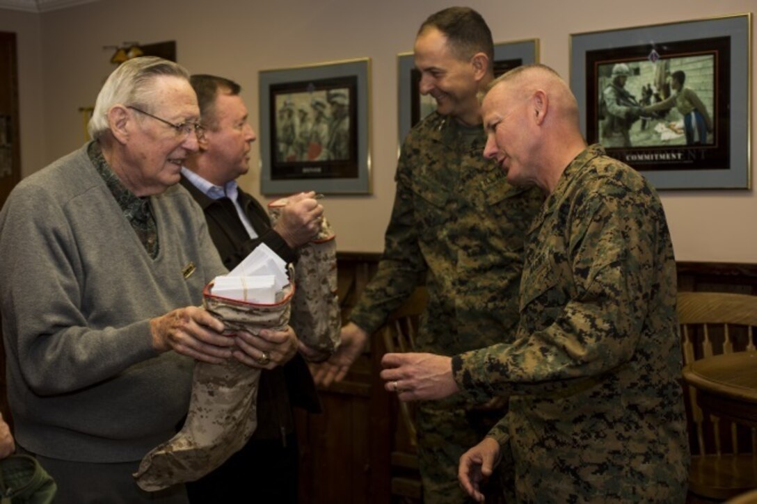 Maj. Gen. Daniel J. O’Donohue and Sgt. Maj. William T. Sowers stand for a quick photo opportunity following a ceremony with the San Diego Nice Guys charity group, Dec. 16, 2015. During the ceremony, the San Diego Nice Guys presented their annual contribution from the Marine Family Christmas Fund to assist local military families in their holiday grocery shopping. Since 1997, the MFCF has supported thousands of families, primarily those who have forward deployed Marines and sailors of the Blue Diamond division, with generous donations for the holiday season.