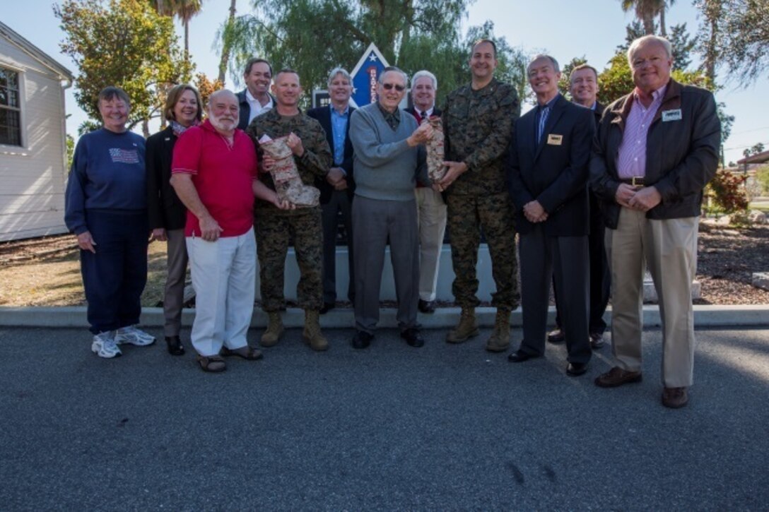 Maj. Gen. Daniel J. O’Donohue and Sgt. Maj. William T. Sowers stand for a quick photo opportunity following a ceremony with the San Diego Nice Guys charity group, Dec. 16, 2015. During the ceremony, the San Diego Nice Guys presented their annual contribution from the Marine Family Christmas Fund to assist local military families in their holiday grocery shopping. Since 1997, the MFCF has supported thousands of families, primarily those who have forward deployed Marines and sailors of the Blue Diamond division, with generous donations for the holiday season.