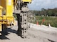 The mud flies as machine functioning as a "vertical chain saw" mixes soil with slurry to form a partial cutoff wall in the Herbert Hoover Dike surround Lake Okeechobee in south Florida.  The work was part of a $220 million investment to reduce the risk of dike failure through installation of 21.4 miles of cutoff wall on the southeast side of the dike.