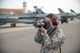 U.S. Air Force Airman 1st Class Cassandra Whitman, a 354th Fighter Wing public affairs photojournalist, takes photos Aug. 4, 2015, during RED FLAG-Alaska 15-3, at Eielson Air Force Base, Alaska. Whitman is approaching the one year mark in the Air Force and reflected on how her decision to join the military has positively affected her life. (U.S. Air Force photo by Staff Sgt. Shawn Nickel/Released)