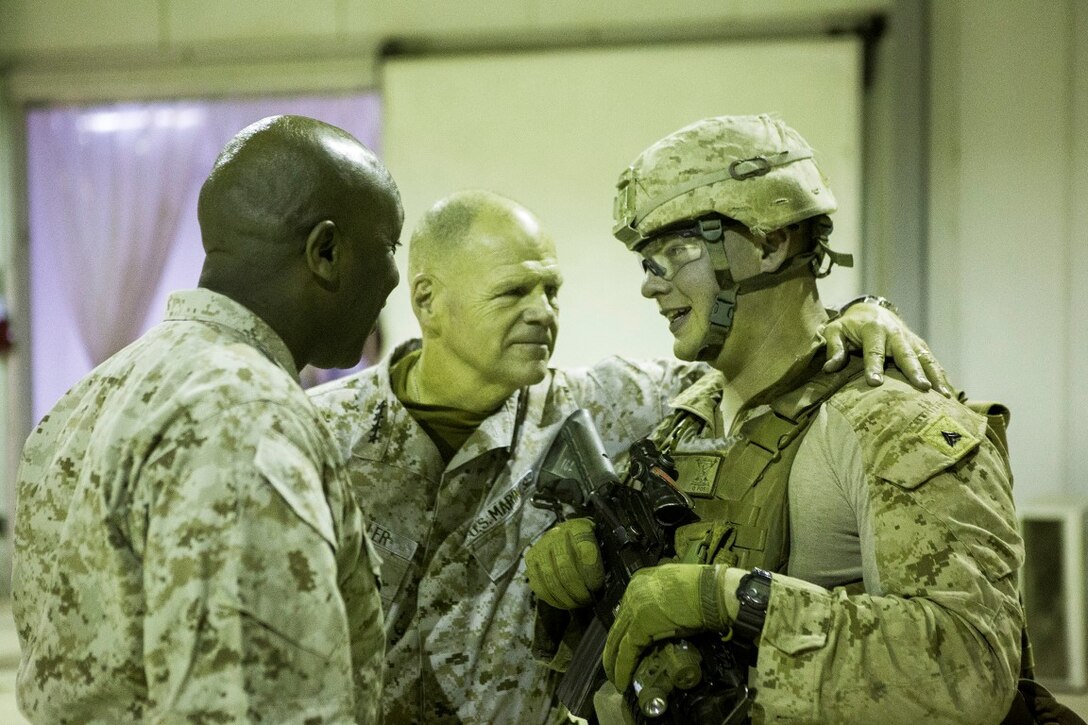 U.S. Marine Gen. Robert B. Neller, 37th commandant of the Marine Corps, and Sgt. Maj. Ronald Green, 18th Sergeant Major of the Marine Corps, speak with U.S. Marine Cpl. Michael Reams, an internal threat mitigation team leader with Company B, 1st Battalion, 7th Marine Regiment, Special Purpose Marine Air Ground Task  Force - Crisis Response - Central Command and Task Force Al Taqaddum at Al Taqaddum, Iraq, Dec. 21, 2015. During their visit to the U.S. Central Command area of responsibility, the leaders addressed Marines and Sailors on matters concerning the future of the Corps and wished them all a merry Christmas. SPMAGTF-CR-CC is deployed with a crisis response mission spanning 20 nations of U.S. Central Command. (U.S. Marine Corps Photo by Sgt. Rick Hurtado / Released)
