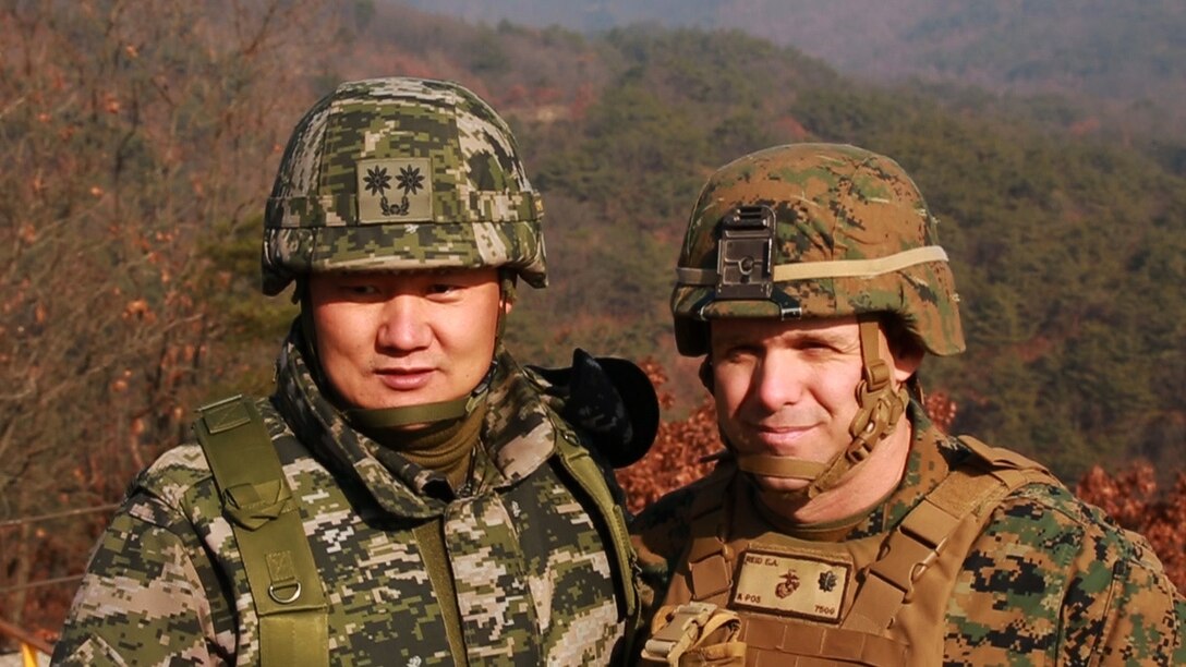 Republic of Korea Marine Lt. Col. Joung Young Oh and  Lt. Col. Eric A. Reid focus on  building lasting, bilateral relationships during the Korean Marine Exchange Program 16-3 at Rodriguez Live Fire Complex, South Korea, Dec. 22, 2015. KMEP 16-3 is one in a series of regularly-scheduled combined, small-unit, tactical training exercises between ROK and forward deployed U.S. Marines. The relationship between ROK and U.S. Marine Corps forces encompasses the strategic, operational, and tactical levels of training. The goal of the KMEP is to enhance and improve interoperability of ROK and U.S. Marine Corps forces at the level to build warfighting capabilities as partners. Lt. Col. Reid is the 1st Battalion, 2nd Marines regiment commander, currently forward deployed in the Pacific as part of 4th Marine Regiment, 3rd Marine Division, III Marine Expeditionary Force. (U.S. Marine Corps Photo by Lance Cpl. Jorge A. Rosales/Released)