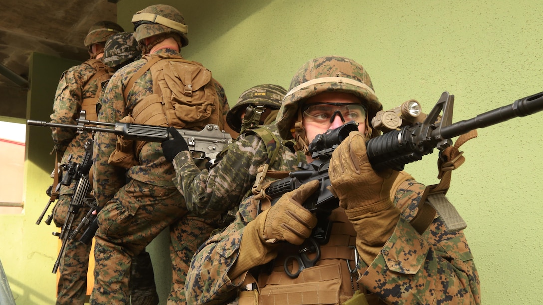 Marines prepare to clear a house alongside ROK Marines during the Korean Marine Exchange Program 16-3 at Rodriguez Live Fire Complex, South Korea, Dec. 22, 2015. KMEP 16-3 is one in a series of regularly-scheduled combined, small-unit, tactical training exercises. The relationship between ROK and U.S. Marine Corps forces encompasses the strategic, operational, and tactical levels of training. The goal of the KMEP is to enhance and improve interoperability of ROK an U.S. Marine Corps forces to build warfighting capabilities as partners. The Marines are from 1st Battalion, 2nd Marines Regiment, currently forward deployed in the Pacific as part of 4th Marine Regiment, 3rd Marine Division, III Marine Expeditionary Force. (U.S. Marine Corps Photo by Lance Cpl. Jorge A. Rosales/Released)