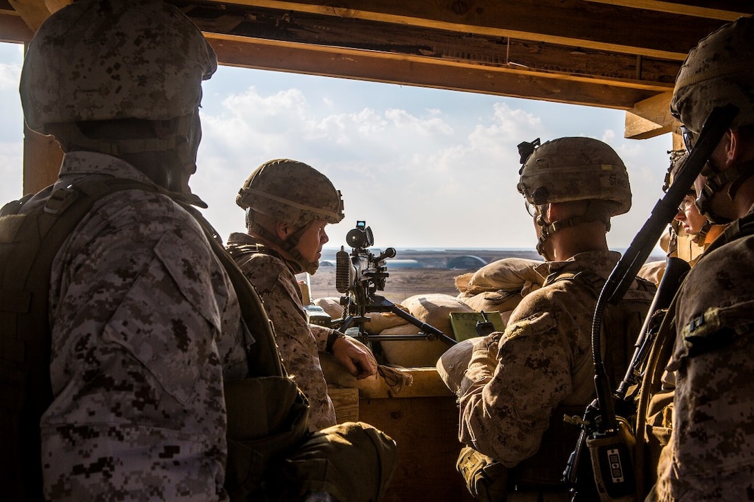 U.S. Marine Gen. Robert B. Neller, 37th commandant of the Marine Corps, and Sgt. Maj. Ronald Green, 18th Sergeant Major of the Marine Corps, visit Marines on post with 1st Battalion, 7th Marine Regiment, Special Purpose Marine Air Ground Task  Force - Crisis Response - Central Command at Al Asad Air Base, Iraq, Dec. 21, 2015. During their visit to the U.S. Central Command area of responsibility, the leaders addressed Marines and Sailors on matters concerning the future of the Corps and wished them all a merry Christmas. SPMAGTF-CR-CC is deployed with a crisis response mission spanning 20 nations of U.S. Central Command. (U.S. Marine Corps Photo by Sgt. Rick Hurtado / Released)