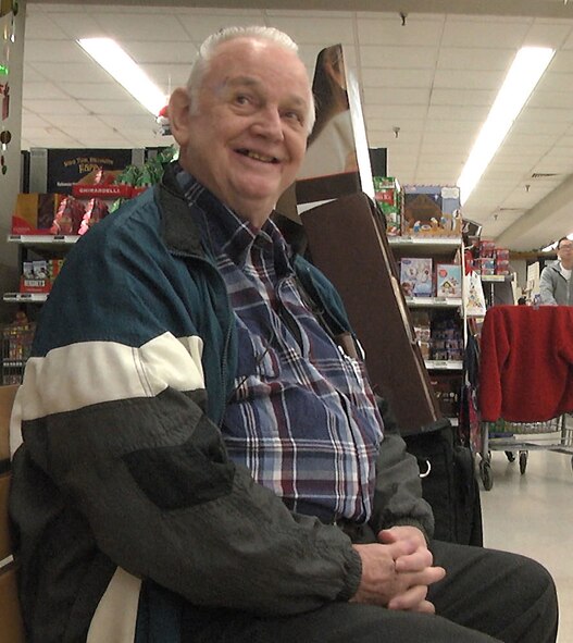 Harold Adams, retired Air Force mechanic, visits the Sheppard Air Force Base commissary Dec. 18, 2015 to give handmade wooden toys to children. (U.S. Air Force photo/Aliza Reisberg)
